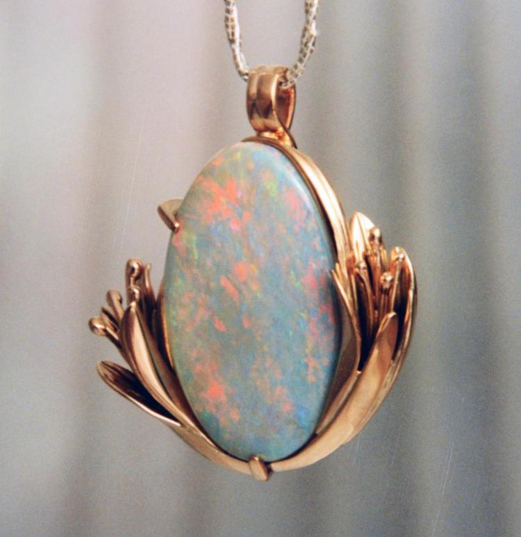 Australian Opal in 14 k. y. Floral Setting