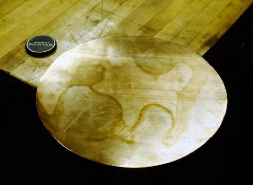 The 12" disc of 16 guage (1.29 mm. thick) red brass.