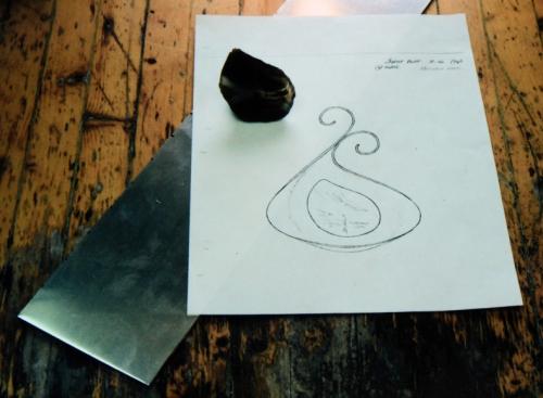 Raw materials: sterling silver sheet (4 inches across X 12 gu. or 2 mm. thick), and the rough slice of Nova Scotia agate.