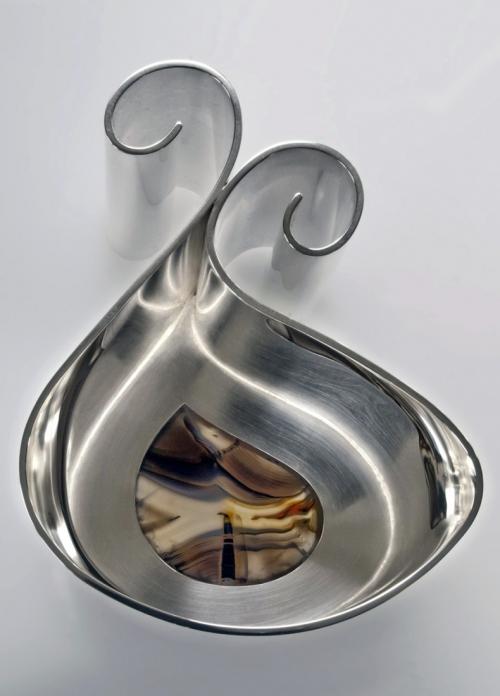 The finished piece. The spouts are flared, the agate is set, and the sterling is polished.