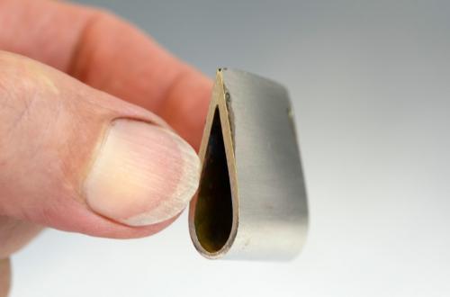 Soldered at the intersection of planes. Both inside surfaces in the area of contact had been bevelled to allow an overall tapered gradation of thickness.