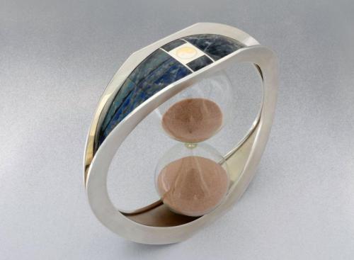 The finished piece showing the side with multi-coloured labradorite. All rivets have been set tightly to the surface of the framework, carefully filed flush and polished.