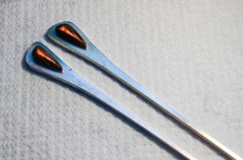 Two strips of sterling sheet are cut to shape.