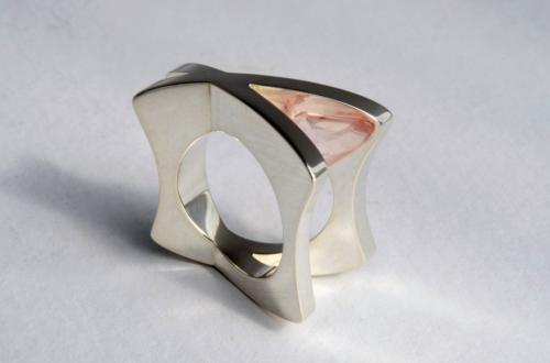 The finished piece. The outside shape of the ring is cut and filed true, and the entire piece is given its final polish.