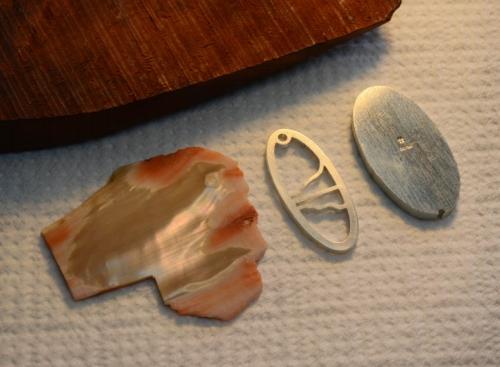 The sliced shell and piece of wood, the sterling framework for the inlay, and the sterling back.