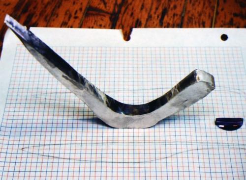 With repeated hammering and annealing, the tightest bend is nearly straightened.