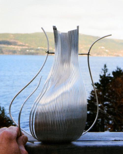 This photograph clearly shows how the process went once the surface was solid. I am holding a wire that has been precisely bent to the needed contour, tapered at both ends, and slightly grooved along the tapered areas. In that way, each wire literally locks itself in place to be soldered.