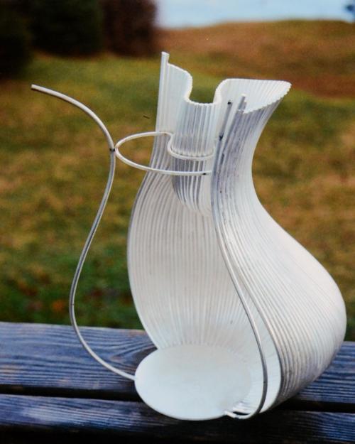 Gradually working around the form, usually at a rate of two or three wires per day. The temporary template is still being used in the narrowest area of the neck.