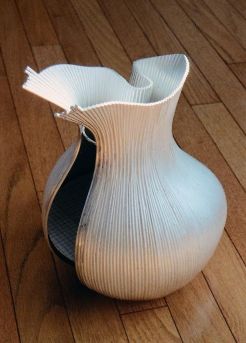 Gradually building toward the spout and the front. Each soldering on one side is mirrored by the doing the same thing on the other side.