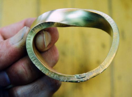 The ends are soldered together with a small rectangular piece of gold layered into the join for strength.