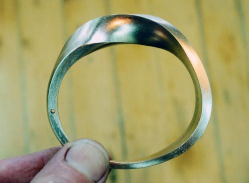 The area of the join has been reduced to nearly half of its original thickness. All surfaces are filed true. The width is drilled through in the place that will become the hinge.