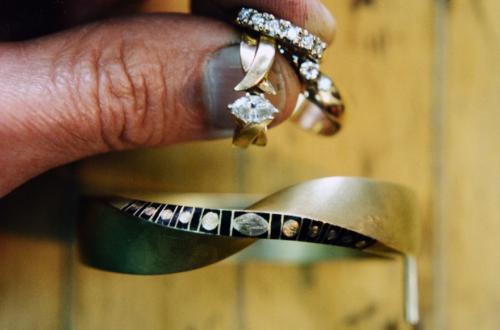 Eleven diamonds are shown in old rings. The edge of the bracelet is marked showing where these stones and the spaces between them are to be.