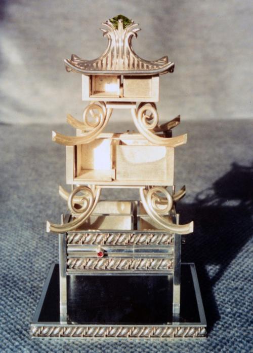 Here the Pagoda is temporarily set up. The bottom and top areas are finished. The drawers in the middle two layers still need to have their wire patterns created and their handles attached. The bottom two roofs are in their early stages of being framed in.