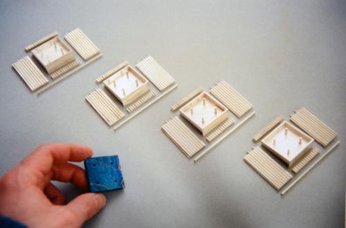 This photo is taken part way through the process of constructing the sides of the box. Four rivet posts can be seen in the areas for the four side panels of labradorite. Less obviously visible, two rivet posts can also be seen at the top of each flattened column panel of sterling — these will be used to secure the four small corner post squares of labradorite on top.