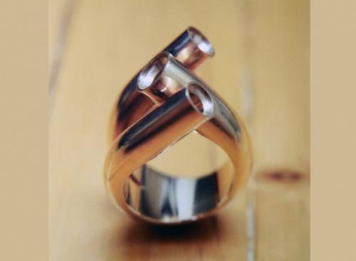 The three circular ends are drilled and the stones are seated in preparation to be bezel set.