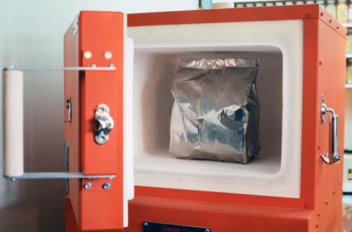 The filled, sealed bag is placed in a digital kiln and heated around 1400 degrees fahrenheit for 14 hours. The temperature is held just below the lowest eutectic alloy melting point that results between the layers. Literally, under heat and pressure, molecular growth between the layers fuses the stacks into solid blocks.