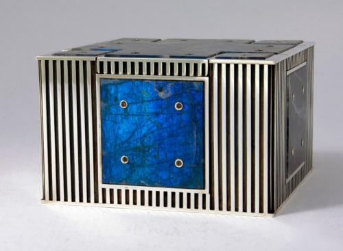 The finished piece. All stones are secured by way of flared rivets. The four walls are also riveted together at the corners, and the four corner stones on top are riveted in place. All surfaces are polished, and the recessed areas of the sterling pattern are oxidized.
