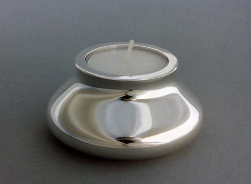 One of the finished set of eight. A receptacle for the votive candle has been constructed and soldered in place. The entire surface is smoothed and polished.