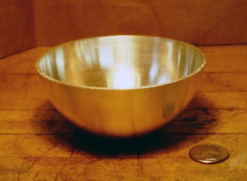 The finished bowl, planished, filed smooth and partly polished.