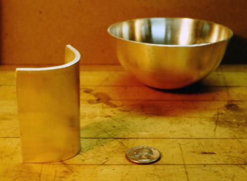 This part of the ingot is also rolled to a 1/8" thickness. The bending into a cylinder is underway.