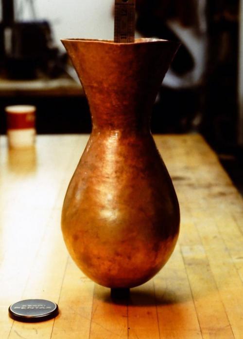 About 38 courses. While being raised upward, the metal is also thickening as the circumference becomes more radically constricted in upon itself.